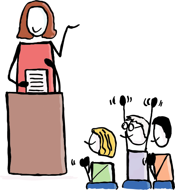 Zwei Personen sitzen an einem Tisch. Auf dem Tisch ist ein Mikrophon, zwei Wassergläser, ein beschriebenes Papier und ein Laptop. Die linke Person sitzt im Rollstuhl. Über ihr ist eine Sprechblase, in der eine Barriere durchgestrichen ist. Die Frau auf der rechten Seite hört überrascht zu.